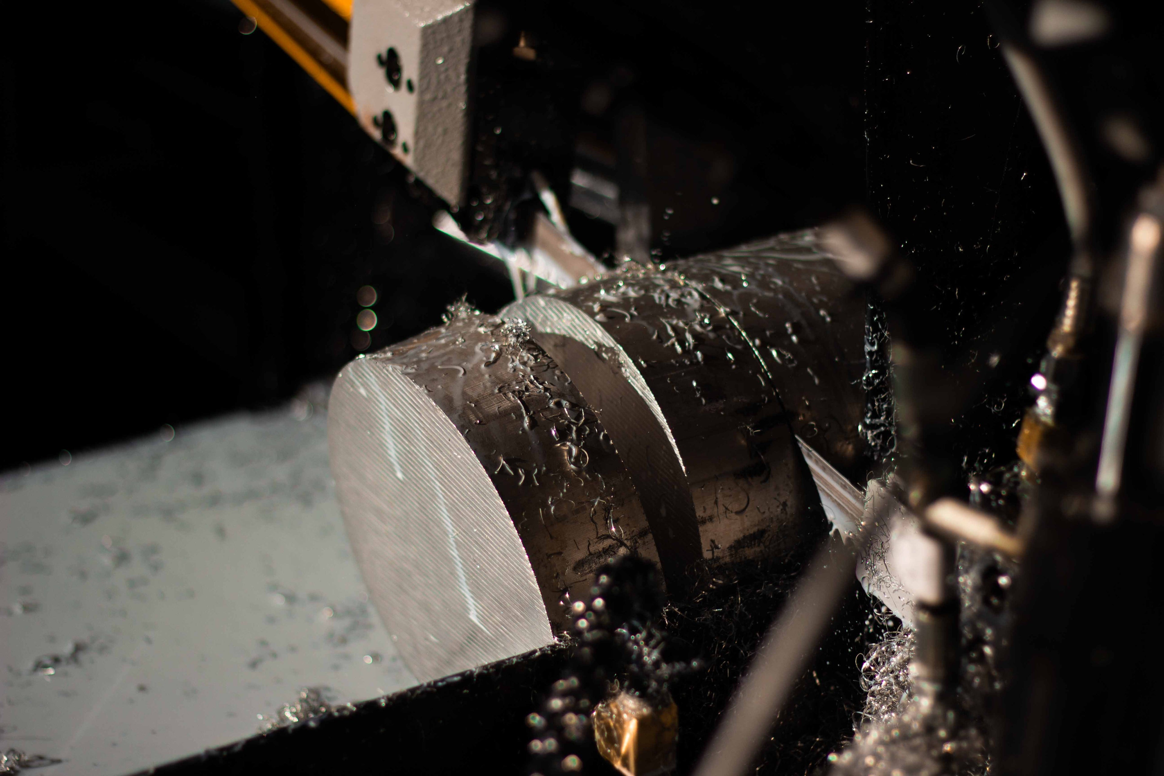 Saw cutting aluminum bar stock into billet blanks for CNC machining at BSB USA.